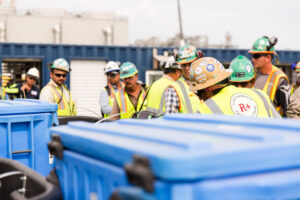 Construction workers getting drinking water from AMECO Ice Workforce Hydration bins on a jobsite